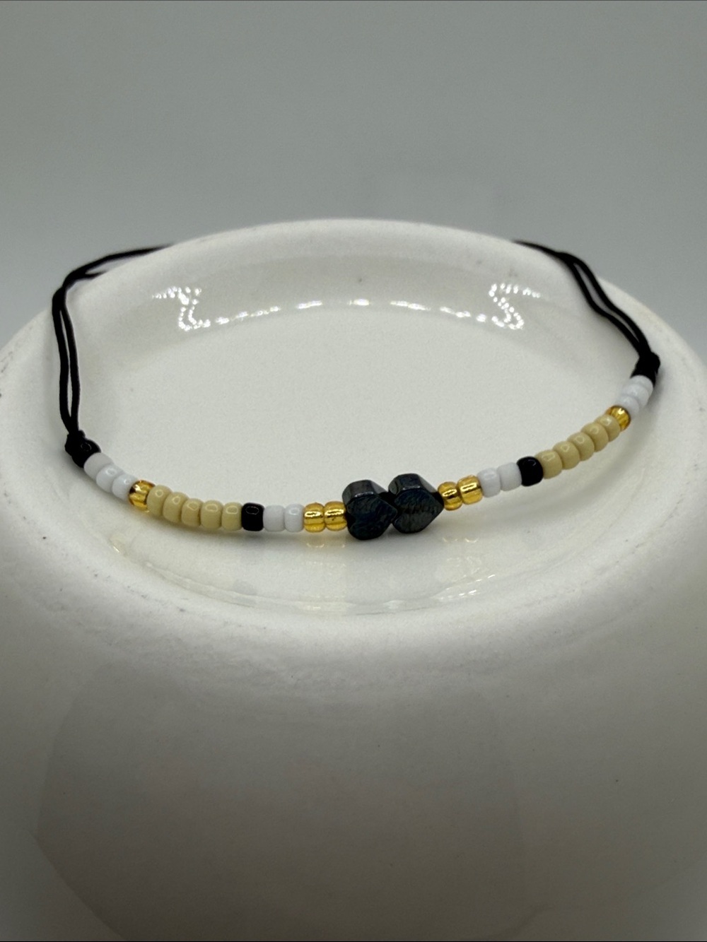 Beaded Hematite Heart Bracelet with Gold & Cream Adjustable Black Cord